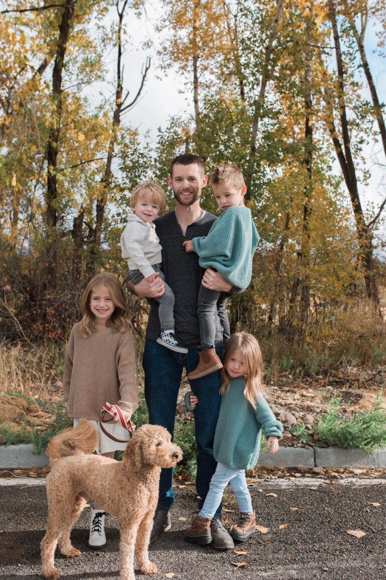 Jaden Zubal family picture outdoors with dog