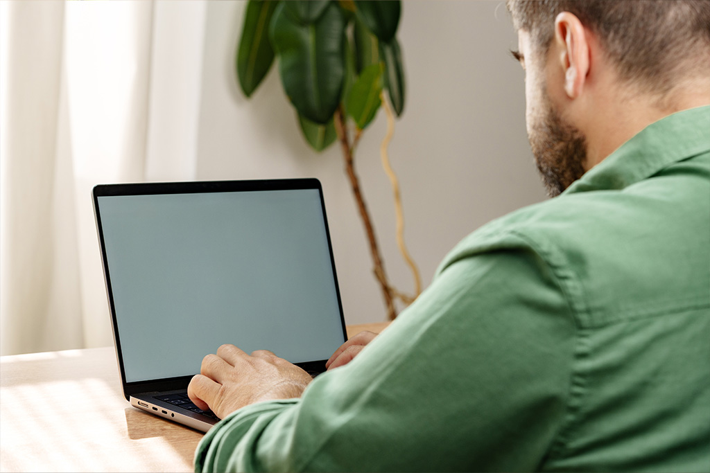 Man typing on laptop