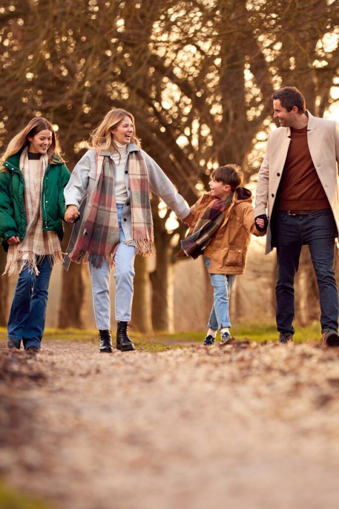 Happy family walking in the fall.