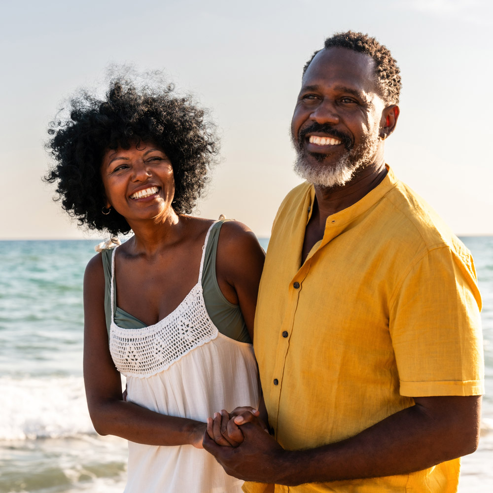 Happy couple on the beach.